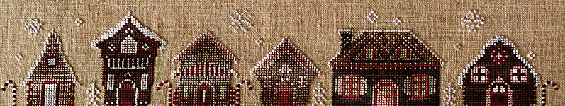 Click for more details of Gingerbread Row (cross stitch) by October House