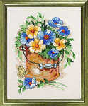 Blue and yellow flowers in a bucket - click for larger image