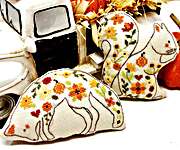 Click/tap for more details of Autumn Animal Pillows (cross stitch) by Tiny Modernist