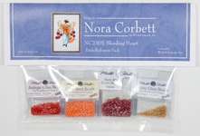 Click for more details of Bleeding Heart Embellishment Pack (beads and treasures) by Nora Corbett