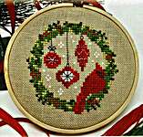 Click/tap for more details of Cardinal Wreath (cross stitch) by Tiny Modernist