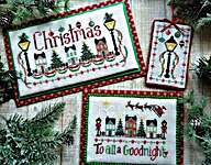 Click/tap for more details of Christmas Street (cross stitch) by Waxing Moon Designs