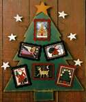 Click/tap for more details of Folk Art Christmas (cross stitch) by The Prairie Schooler