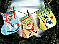 Click/tap for more details of Gift Stocking Bunting (cross stitch) by Tiny Modernist