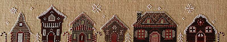 Click/tap for more details of Gingerbread Row (cross stitch) by October House