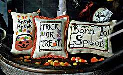 Click/tap for more details of Halloween Trio (cross stitch) by puntiniputini