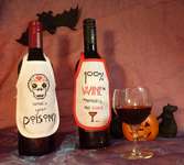 Click for more details of Halloween Wine Bottle Aprons (cross stitch) by Julie Lynes