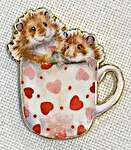 Click/tap for more details of Hammy Anniversary Needle Minder (needle minders) by Bothy Threads