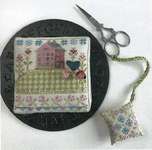 Click for more details of House on a Hill Pincushion and Fob (cross stitch) by Hands On Design