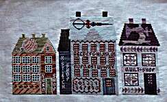 Click/tap for more details of Needlework Village (cross stitch) by Thistles
