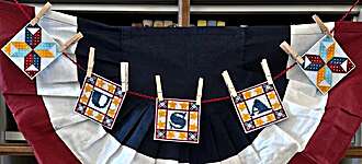 Click/tap for more details of Patriotic Garland (cross stitch) by Luhu Stitches