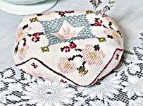 Click/tap for more details of Summer Biscornu (cross stitch) by Antique Needleworkers