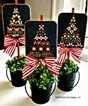 Click/tap for more details of The Tree Lot (cross stitch) by Hands On Design