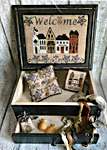 Click/tap for more details of 'The Welcome Street' Sewing Box (cross stitch) by Mani di Donna