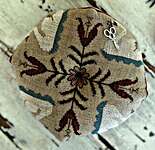 Click/tap for more details of Trumpet Of Swans Biscornu (cross stitch) by Stacy Nash Primitives