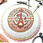 Click/tap for more details of Vintage Paris Pin Cushion (cross stitch) by Tiny Modernist