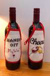 Click for more details of Wine Bottle Aprons - Cheers and Hands Off (cross stitch) by Julie Lynes