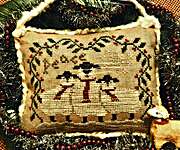 Click/tap for more details of Wishing Ewe Christmas Peace (cross stitch) by Homespun Elegance