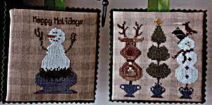 Click/tap for more details of X-mas In A Pot (cross stitch) by Thistles