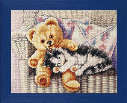 Kitten with teddy bear